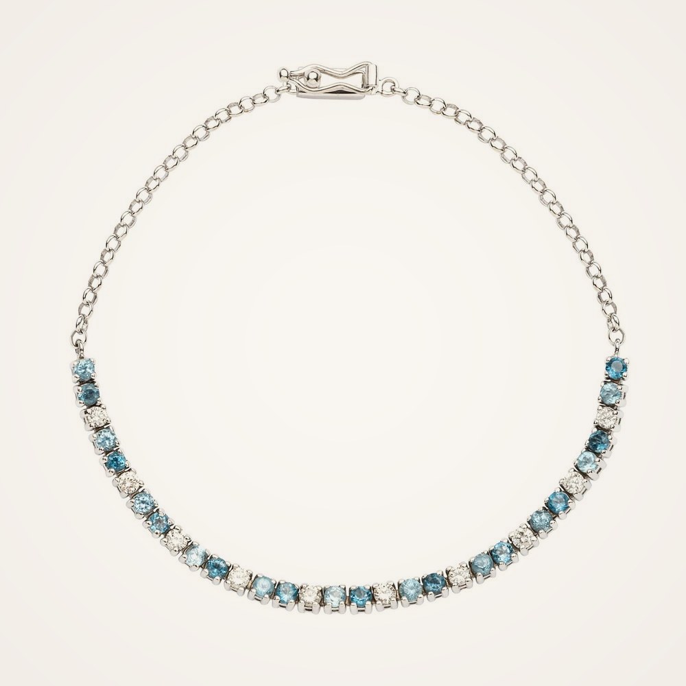 Pulseira meia riviera com diamantes e topázios azuis